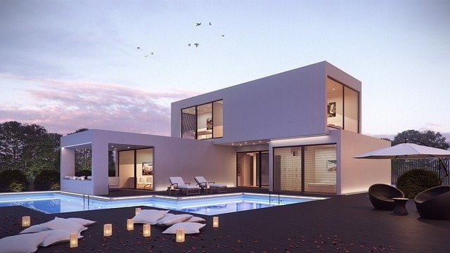Image of a beautifully built house with a lovely swimming pool.