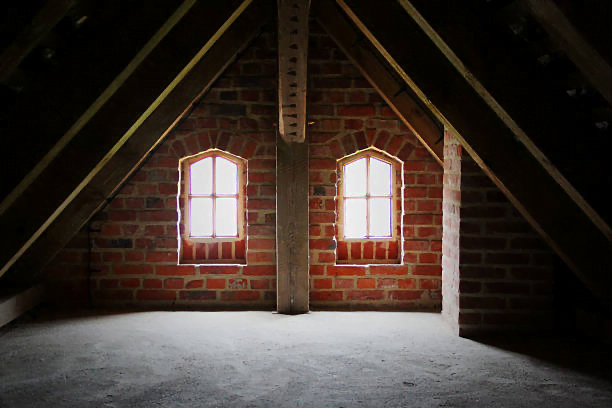 An empty loft space with potential for conversion into an extra bedroom, bathroom, library, or office. Unlock the benefits of loft conversions and increase your property value today.