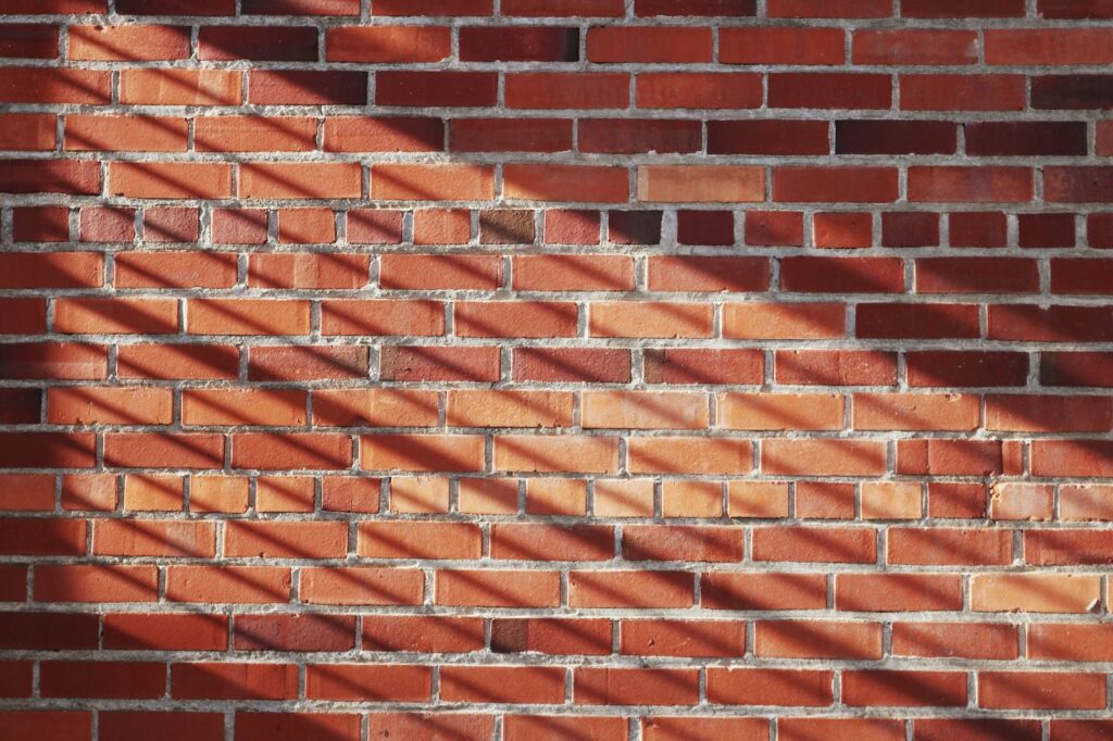 A cavity wall with insulation material between brick layers, demonstrating the thermal performance and moisture control in a well-insulated home