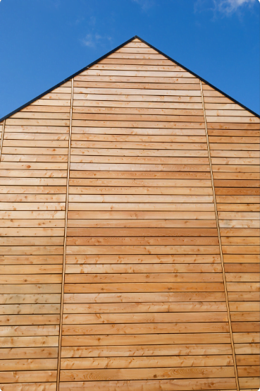 Image of a contemporary UK home with exterior cladding demonstrating the transformative impact of cladding on architectural design.