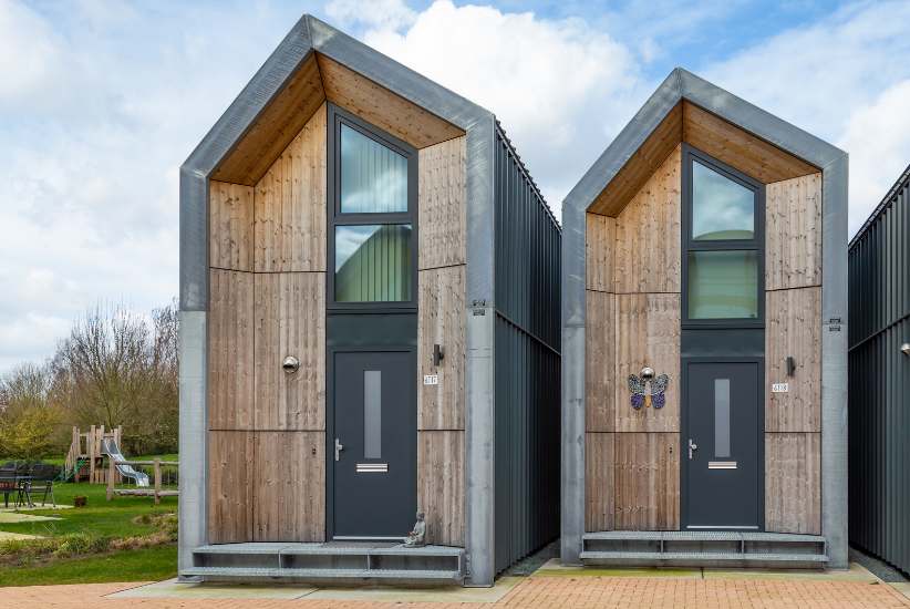 Architectural design blueprint showcasing innovative compact living solutions, featuring loft conversions, tiny homes, and space-saving techniques.